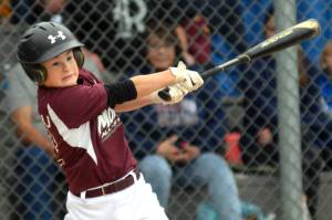 RYAN SPARKS | THE DAILY WORLD Montesanos Kale Kjesbu smacks a single during an 8-5 loss to Larch Mountain in the Little League District 3 Majors Tournament on Friday in Aberdeen.