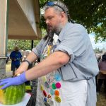 Clayton Franke / The Daily World
Jeffrey Big Prowse slices watermelon at the McCleary Bear Festival on Saturday, July 8.
