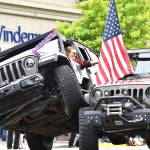 Fallon Johnson, of Jeeps of Washington, performs "Jeep Stacking" for the large crowd that assembled for Aberdeen Founder's Day Parade on Saturday afternoon in downtown Aberdeen. (Matthew N. Wells / The Daily World)