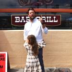 Matthew N. Wells / The Daily World
Ryan Dokke, a 2001 Hoquiam High School graduate, gets inducted into Aberdeens Walk of Stars on Saturday afternoon. Dokke, who was humble in his speech as he thanked his wife, family, people who helped him throughout his career, as well as Jesus Christ, worked his way from bussing tables as a teenager at Billys. An internship at KXRO launched his career, which has seen him travel across the county and land at Big Machine Label Group, in Nashville. Dokke wants to do anything, to help fellow Harborites reach their dreams. One of his young daughters celebrates her dads induction with a big hug.