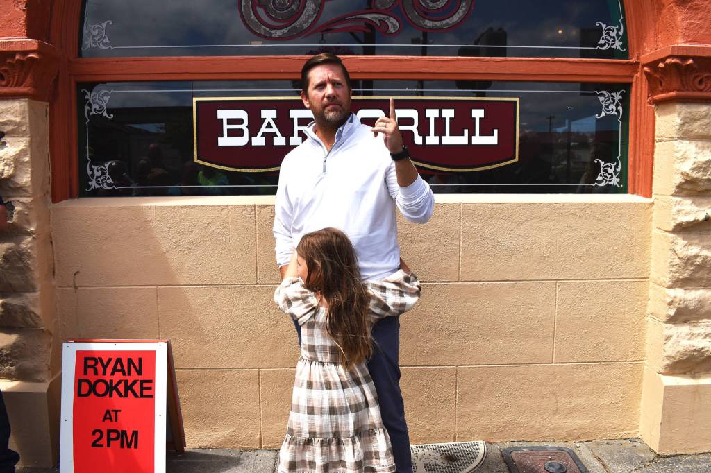 Matthew N. Wells / The Daily World
Ryan Dokke, a 2001 Hoquiam High School graduate, gets inducted into Aberdeens Walk of Stars on Saturday afternoon. Dokke, who was humble in his speech as he thanked his wife, family, people who helped him throughout his career, as well as Jesus Christ, worked his way from bussing tables as a teenager at Billys. An internship at KXRO launched his career, which has seen him travel across the county and land at Big Machine Label Group, in Nashville. Dokke wants to do anything, to help fellow Harborites reach their dreams. One of his young daughters celebrates her dads induction with a big hug.