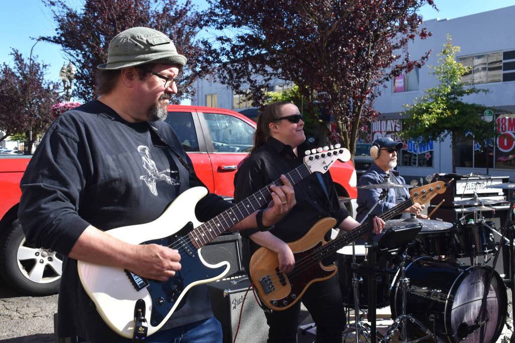 Matthew N. Wells / The Daily World
Don Stone, from left, Chloe Pickney and Duke Harner, added a strong presence to Ms. Maki and Co., on Saturday at Aberdeen Founders Day Street Dance on Broadway Street in downtown Aberdeen. Stones lead guitar work made it sound as though the late-Ed King himself was playing Lynyrd Skynyrds Sweet Home Alabama.