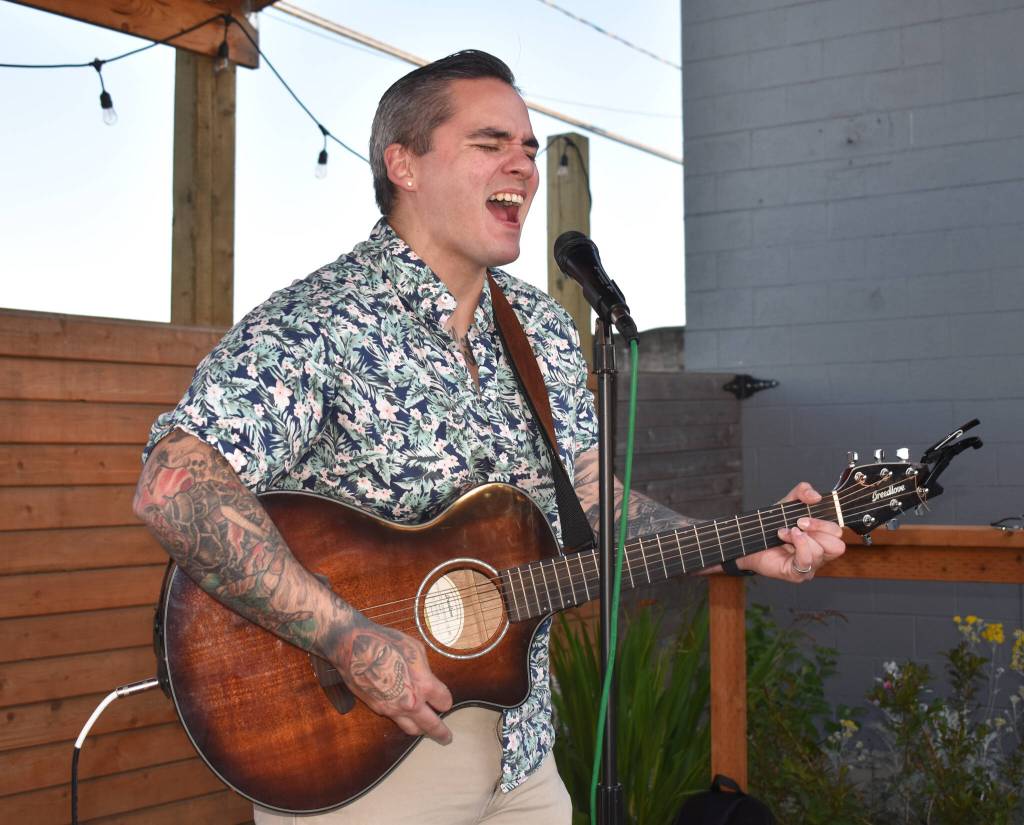 Matthew N. Wells / The Daily World
Rullen Neifert, sang his heart out during Alice in Chains Rooster as he played a cool set at Mount Olympus Brewing. While he wasnt part of Aberdeen Founders Day Street Dance, it was unique to hear two artists play at the same time, outdoors, in Aberdeen. Electric Eye, who played the second set at Aberdeen Founders Day Street Dance, played a rocking set a few hundred feet away.