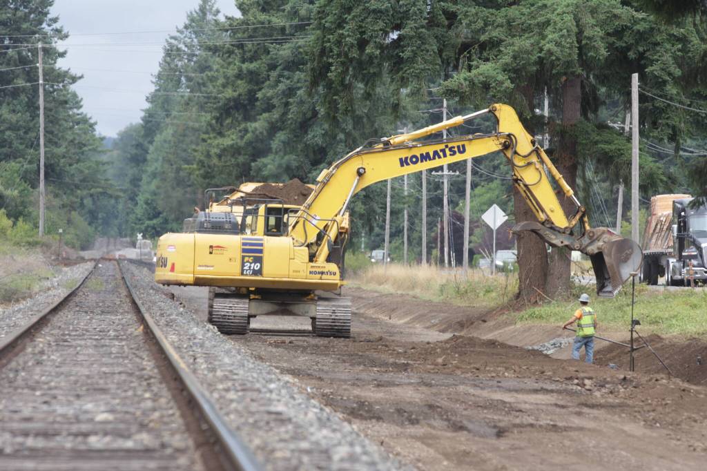 Work crews clear space for a siding for Puget Sound and Pacific Railroad south of Elma on July 12. (Michael S. Lockett / The Daily World)