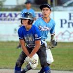 RYAN SPARKS | THE DAILY WORLD
Elma's Brysten Crawford, foreground, leads off second base as Bellevue National shortstop Ryota Suzuki keeps a close eye during Elma's 14-0 loss at the Little League Intermediate State Tournament on Thursday in Elma.
