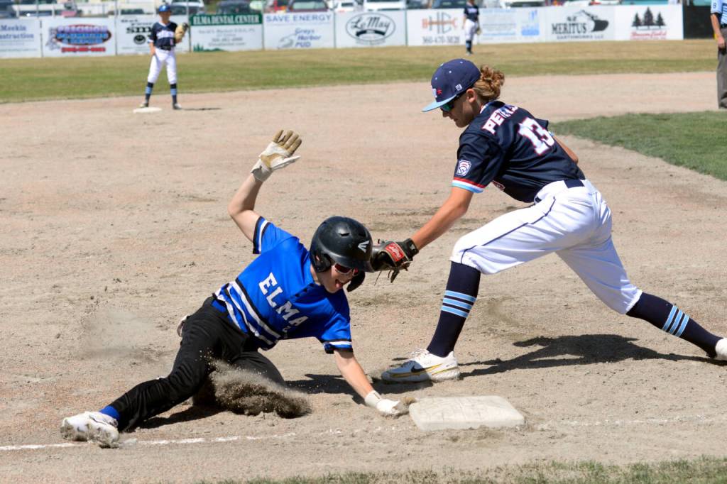 RYAN SPARKS | THE DAILY WORLD Elmas Hunter Young, left, steals third while Bellevue Nationals Derrick Peterson defends during a Little League Intermediate 50/70 State Championship game on Saturday in Elma.