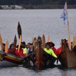 Three Quileute canoes approach the shores of Neah Bay on Friday, July 21 as part of the 2023 Paddle to Muckleshoot intertribal canoe journey. The canoes left La Push at 5 a.m. Friday morning and arrived at the shores of Neah Bay more than 12 hours later. (Clayton Franke / The Daily World)