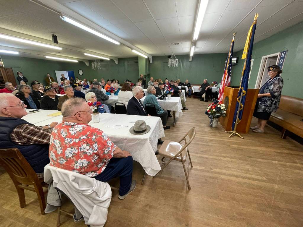 Post Commander Gwyn Tarrence addresses the crowd at the American Legion in Aberdeen during a pinning ceremony for Vietnam veterans. (Michael S. Lockett / The Daily World)