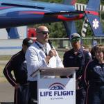 Life Flight Network Ben Clayton speaks during a grand opening ceremony for the organization at Bowerman Airport on July 26. (Michael S. Lockett / The Daily World)