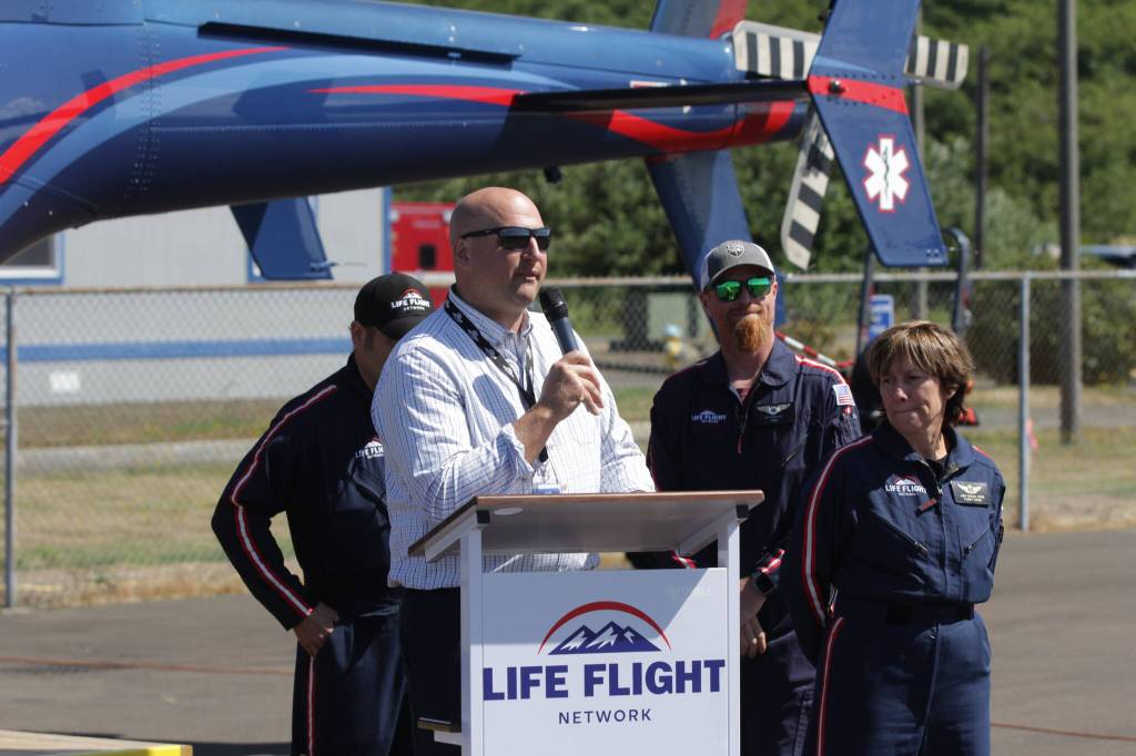 Life Flight Network Ben Clayton speaks during a grand opening ceremony for the organization at Bowerman Airport on July 26. (Michael S. Lockett / The Daily World)