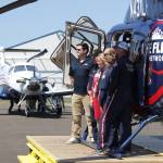 A Life Flight Network flight crew and local officials pose for a photo during the organizations grand opening ceremony at Bowerman Airport on July 26. (Michael S. Lockett / The Daily World)