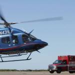A Life Flight Network medevac helicopter takes off after a call to transport a patient from the Hoquiam Fire Department interrupted a grand opening ceremony for the organization at Bowerman Airport on July 26. (Michael S. Lockett / The Daily World)