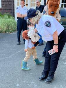 The Daily World File
Betsy Seidel, Hoquiam Police Crime Watch coordinator, has McGruff the Crime Dog Jr., give a kiss to one of the many children at National Night Out on Tuesday, Aug. 2, 2022, at Polson Museum.