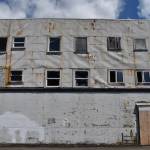 Matthew N. Wells / The Daily World
Heres the backside of the property at 209 W. Wishkah St. Though its not visible from vehicle traffic heading west on Wishkah, the broken windows and exposed boards can be seen from the parking lot just west of it. Lisa Scott, Aberdeens community development director, shared this building was one of the vacant properties the city aims to improve through its vacant building program.