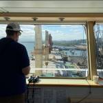 Harbor pilot Capt. Ryan Leo of the Port of Grays Harbor eases the SLNC Severn into dock in Grays Harbor on July 27. (Michael S. Lockett / The Daily World)