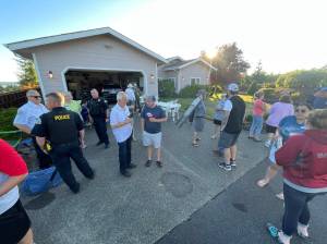 Michael S. Lockett / The Daily World
Aberdeen police and residents mingle during a National Night Out event on Aug. 1.
