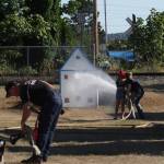 Michael S. Lockett / The Daily World
East Grays Harbor Fire & Rescue personnel teach kids how to use the fire hoses during the National Night Out event in Elma.