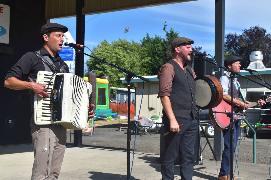 Matthew N. Wells / The Daily World
Lions of the North, a rowdy Celtic folk band from California, set itself on hyperdrive near the end of their set Friday afternoon as they sung their hearts out for a happy audience. Wherever there is a need for jaunty celtic folk music well be there, their band website states. The good news for the people on the short stands at the Jodesha Broadcasting stage was despite the hot day in Elma, the well-dressed men werent affected and they gave the performance their all.
