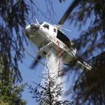 A helicopter drops water on the Margarita wildfire on August 4. (Michael S. Lockett / The Daily World)
