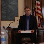 Sgt. David Blundred of the Hoquiam Police Department, lead investigator in the case surrounding a shooting death at the Ace of Clubs Tavern last year, holds the box containing the revolver used in the shooting. (Michael S. Lockett / The Daily World)