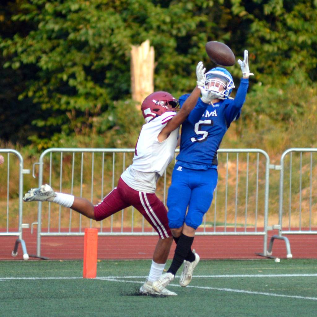 RYAN SPARKS | THE DAILY WORLD Hoquiam defender Javonni Koth, left, breaks up a pass intended for Elma receiver Dayton Brookins during the 15th Annual Montesano Jamboree on Friday at Jack Rottle Field.