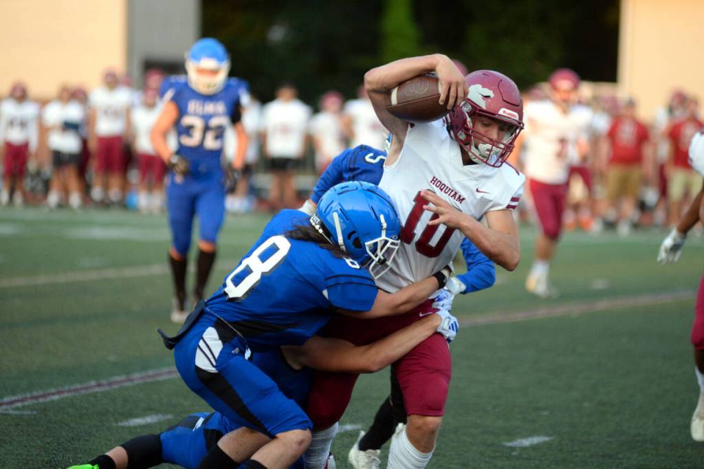 RYAN SPARKS | THE DAILY WORLD Hoquiam senior Zander Jump (10) attempts to elude the tackle of Elmas Kale Reeves (8) during the 15th Annual Montesano Jamboree on Friday at Jack Rottle Field.