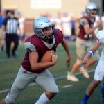 RYAN SPARKS | THE DAILY WORLD Montesano quarterback Jaxson Wilson carries the football against Rochester during the 15th Annual Montesano Jamboree on Friday at Jack Rottle Field.