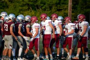 RYAN SPARKS | THE DAILY WORLD Players from Hoquiam (foreground) and Montesano football teams shake hands during the 15th Annual Montesano Jamboree on Friday at Jack Rottle Field.