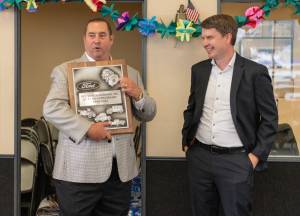 Alicia Tisdale / Five Star Dealerships
Rich Hartman, left Five Star Dealerships owner, holds a 
25-year anniversary plaque, accompanied by Ford Regional Manager Steven Kettler, during a celebration on Monday, Aug. 28 at the dealerships East Aberdeen location.
