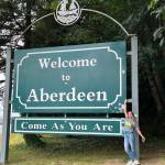 Provided photo
A friend captures Zoé Rouxs spirit at the Welcome to Aberdeen sign. Roux, who studied as a junior at Aberdeen High School during the 2015-16 school year as part of the Aberdeen Rotary Clubs Long-Term Exchange Program, shows the positive energy she exudes in a recent visit back to Grays Harbor.