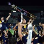 RYAN SPARKS | THE DAILY WORLD Aberdeen senior Patrick Walsh (8) raises the Myrtle Street Rivalry trophy after the Bobcats defeated Hoquiam 36-0 on Friday at Stewart Field in Aberdeen.