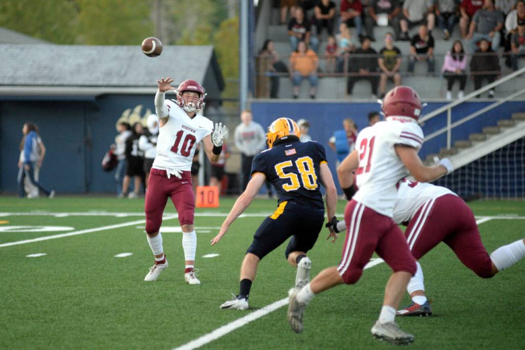 RYAN SPARKS | THE DAILY WORLD Hoquiam quarterback Zander Jump (10) passes to Dominic Standstipher (21) during a 36-0 loss to Aberdeen on Friday at Stewart Field in Aberdeen.