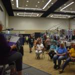 Sandy McCulloch, whose life has taken her from California to Alaska, shares a variety of poetry in front of an attentive audience at the 54th annual Associated Arts Ocean Shores Arts & Crafts Festival. McCulloch called it "an honor," for her to be asked to share her work. McCulloch loved being at the festival. "It's absolutely fabulous and very upscale," McCulloch said. (Matthew N. Wells / The Daily World)