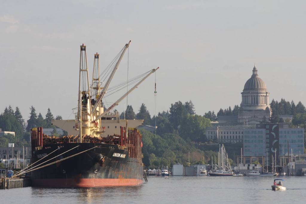 The state capitol building in Olympia stands in the sinking sun as the Lady Washington sails north on September 2. (Michael S. Lockett / The Daily World)