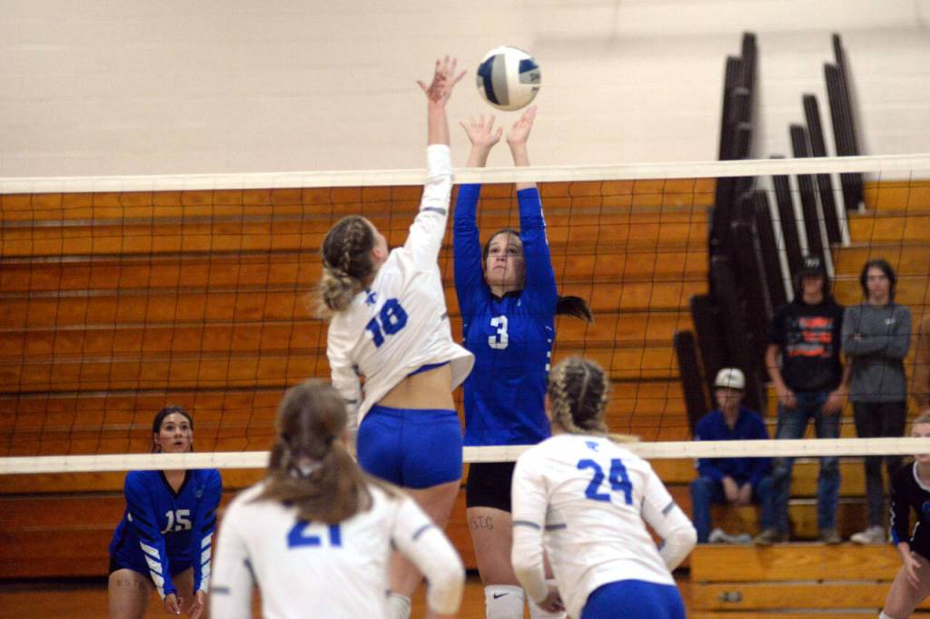 RYAN SPARKS | THE DAILY WORLD Elma sophomore middle hitter Jenessa Sackrider (3) attempts to block the attempt of La Centers Whitney Martell during the Eagles straight-set loss on Tuesday in Elma.