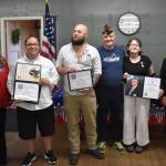 Clayton Franke / The Daily World
From left: Auxilary President Barbra Dyer, reporters Matthew N. Wells and Michael Lockett, veterans service officer Jim Daly, student Macie Leach and Aberdeen VFW commander Anthony Magri pose for a photo during the VFW Publication Contest award ceremony on Tuesday, Sept. 5.