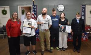 Clayton Franke / The Daily World
From left: Auxilary President Barbra Dyer, reporters Matthew N. Wells and Michael Lockett, veterans service officer Jim Daly, student Macie Leach and Aberdeen VFW commander Anthony Magri pose for a photo during the VFW Publication Contest award ceremony on Tuesday, Sept. 5.