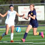 RYAN SPARKS / THE DAILY WORLD Aberdeen forward Annie Troeh, right, collapses on the ball against Hockinson defender Lila Erickson during a 2-0 loss on Wednesday at Stewart Field in Aberdeen.
