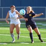 RYAN SPARKS / THE DAILY WORLD Aberdeen junior Scotlyn Lecomte, right, competes with Hockinsons Bridget Brennan for possession during the Bobcats 2-0 loss in a season-opening game on Wednesday in Aberdeen.