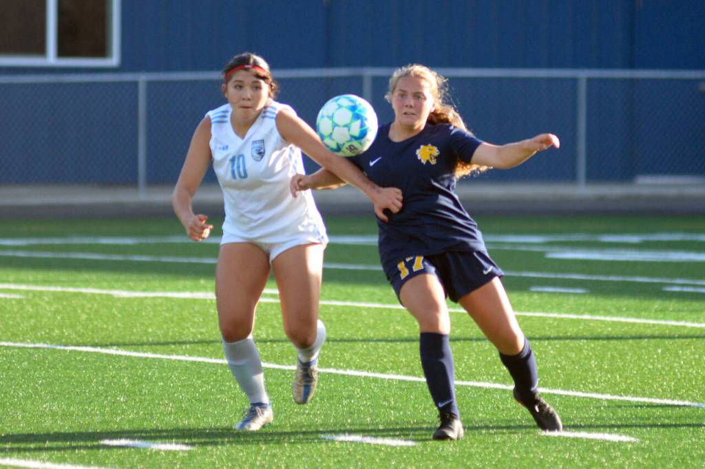 RYAN SPARKS / THE DAILY WORLD Aberdeen junior Scotlyn Lecomte, right, competes with Hockinsons Bridget Brennan for possession during the Bobcats 2-0 loss in a season-opening game on Wednesday in Aberdeen.