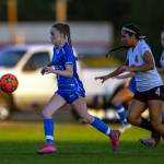 PHOTO BY FOREST WORGUM Elma junior midfielder Valerie Echeverria pulls away from the Centralia defense during a 5-0 win on Thursday in Elma. Echeverria had three goals and two assists in the game.