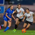 PHOTO BY FOREST WORGUM Elma forward Beta Valentine, left, maneuvers through the Centralia defense during a 5-0 win over the Tigers on Thursday at Davis Field in Elma.