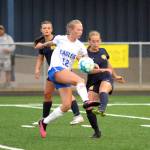 RYAN SPARKS | THE DAILY WORLD Elma junior forward Beta Valentine (12) attempts to block the clearance of Aberdeen sophomore Lila Erickson during the Eagles 1-0 victory on Tuesday at Stewart Field in Aberdeen.