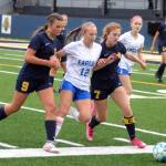 RYAN SPARKS | THE DAILY WORLD
Elma forward Beta Valentine (12) is squeezed by Aberdeen defenders Sawyer Shoemaker (9) and Zoe Troeh during the Eagles' 1-0 victory on Tuesday at Stewart Field in Aberdeen.