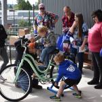 The Daily World file photo
Wellness fair attendees ride a blender-powering bicycle at the 2022 Summit Pacific Peak Health and Wellness Fair.