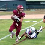PHOTO BY BEN WINKELMAN Hoquiam quarterback Zander Jump rolls out during a 55-27 loss to La Salle on Friday at Olympic Stadium in Hoquiam.