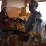 Clayton Franke / The Daily World
Kerri Bramstedt, right, and Joelle Buckman prepare bags of apples at the Aberdeen Food Bank on Sept. 19.