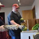Clayton Franke / The Daily World
Volunteers Joelle Buckman, left, and Oscar Bramstedt prepare meal boxes at the Aberdeen Food Bank, located at 2120 Commerce St., on Tuesday, Sept. 19.