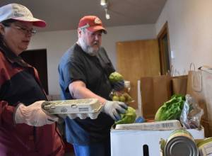 Clayton Franke / The Daily World
Volunteers Joelle Buckman, left, and Oscar Bramstedt prepare meal boxes at the Aberdeen Food Bank, located at 2120 Commerce St., on Tuesday, Sept. 19.