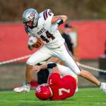 PHOTO BY FOREST WORGUM Montesano running back Gabe Bodwell trucks Castle Rock linebacker Ian Burton for a touchdown in a 35-7 win on Thursday in Castle Rock.